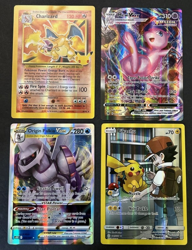 Four trading cards featuring various characters on a black background available on eBay USA